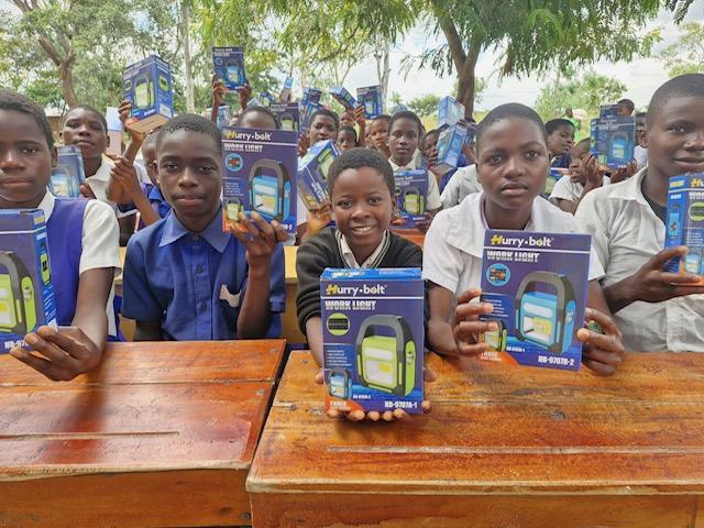 Students receive solar lamps